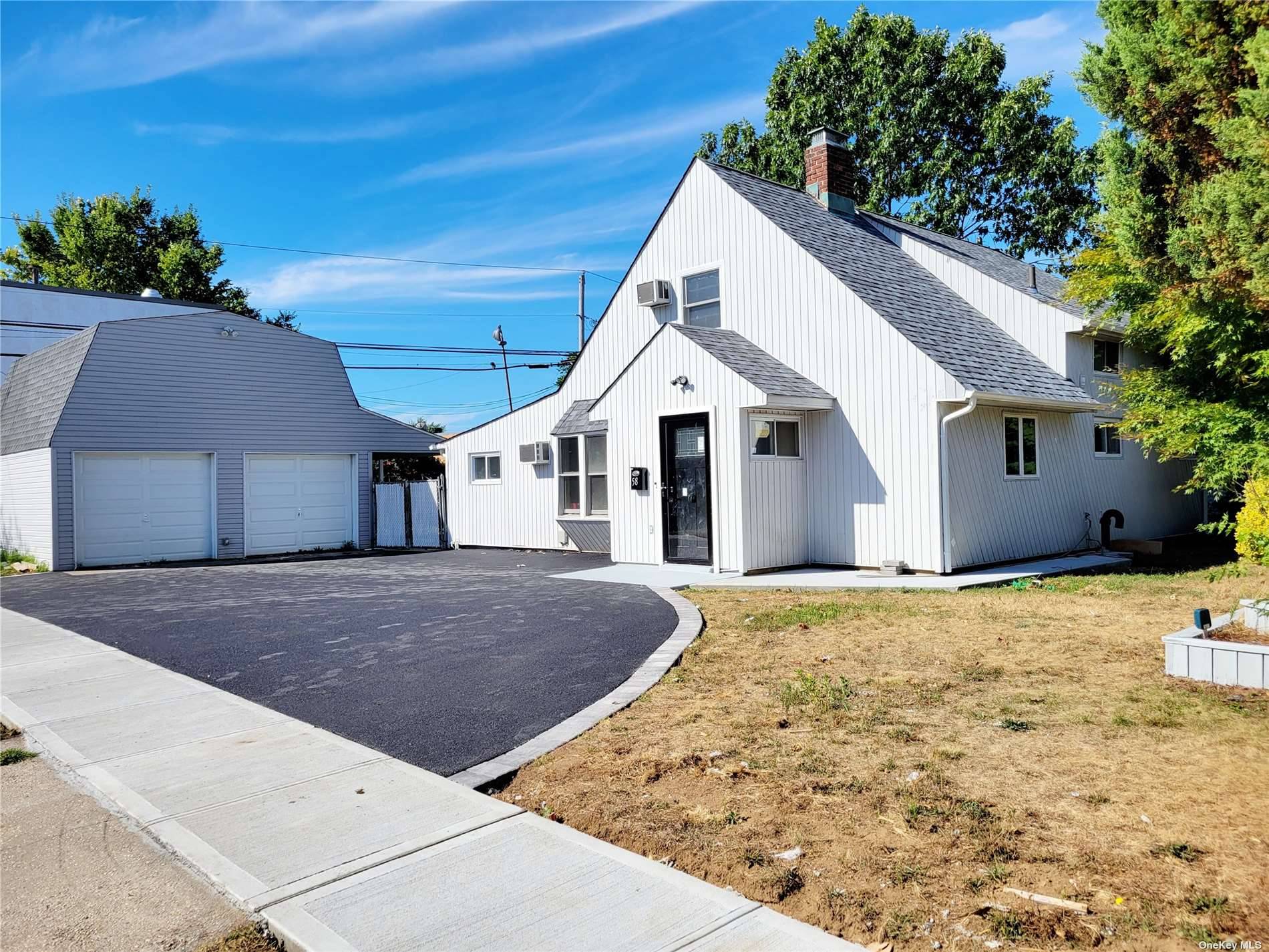 Newly Renovated expanded cape in the heart of Levittown, featuring 5 Bedrooms, 2 Baths, New Kitchen with custom cabinets, stainless steel appliances and quartz counters, updated bathrooms, separate 2 car ...