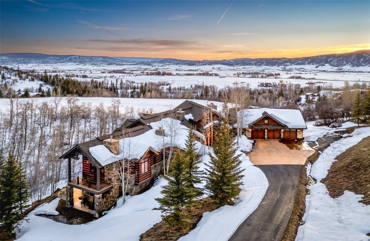 This expansive estate is situated on the 7th fairway of the esteemed Catamount Ranch golf course and just minutes from Steamboat Resort.