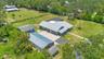 Aerial View of ADU, 6 car garage, Workshop (2 car space) and 2/1 guest unit with a loft and kitchenBrand new Hardie Board siding on ADU, metal roof on