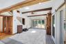Generous size Family Room with sliding glass doors to back deck with jacuzzi and outdoor shower.
