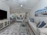 This warm and inviting space is the perfect place to enjoy a movie after a day at the beach on on the golf course