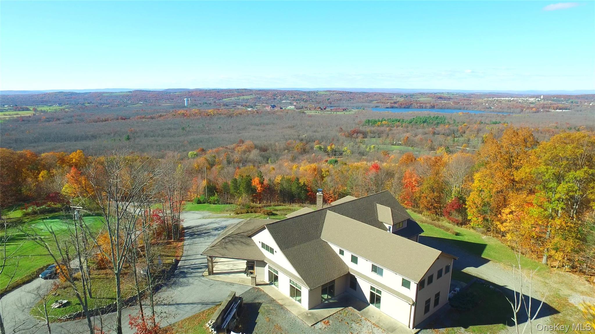 Extraordinary, stop in your tracks views can be yours year-round. This home is perched above the sought-after Warwick Valley, including Wickham Lake
