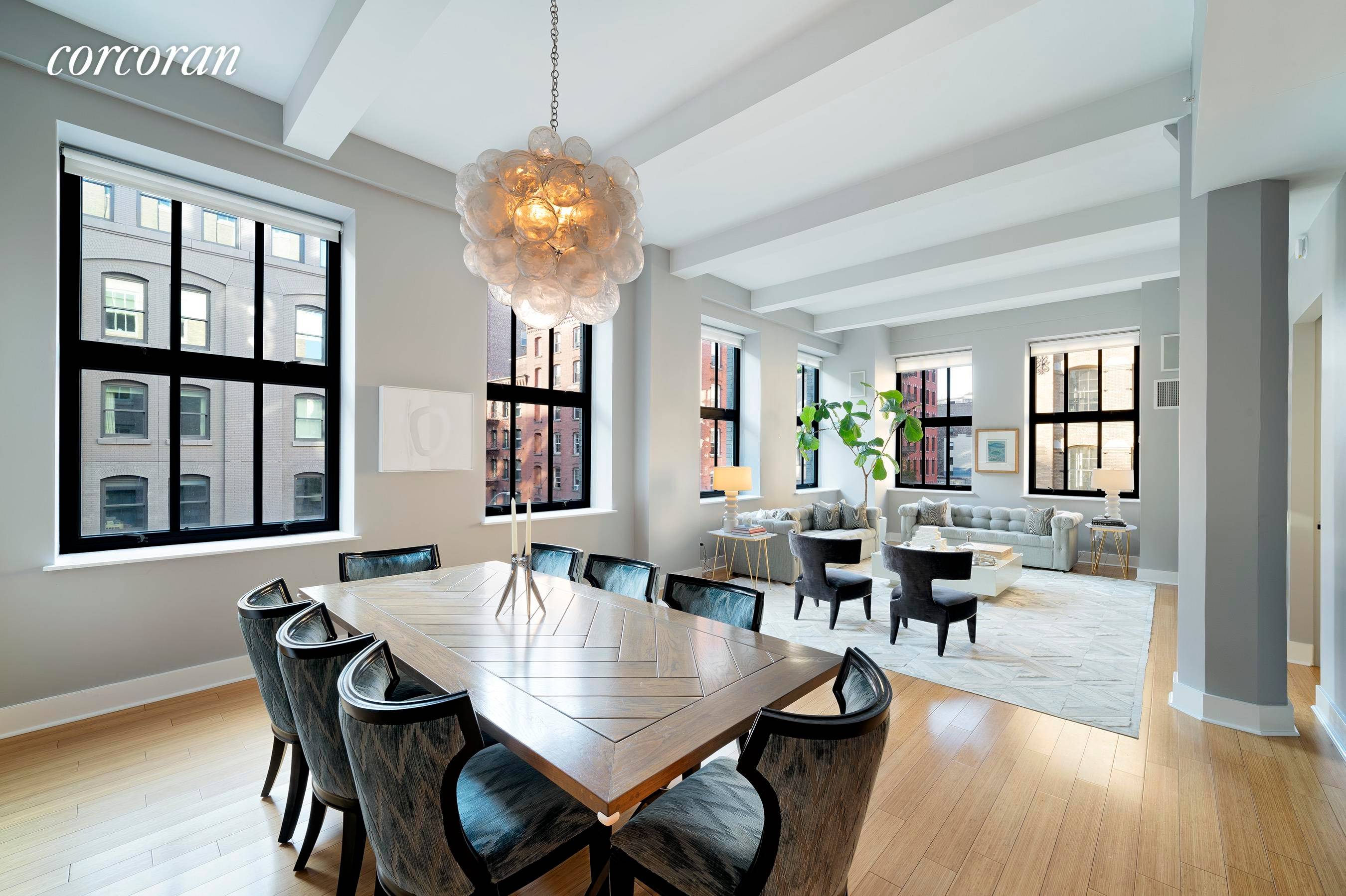 Exquisite luxury and dramatic proportions await in this premier three bedroom, three and a half bathroom loft in one of Tribeca's best full service condominiums.
