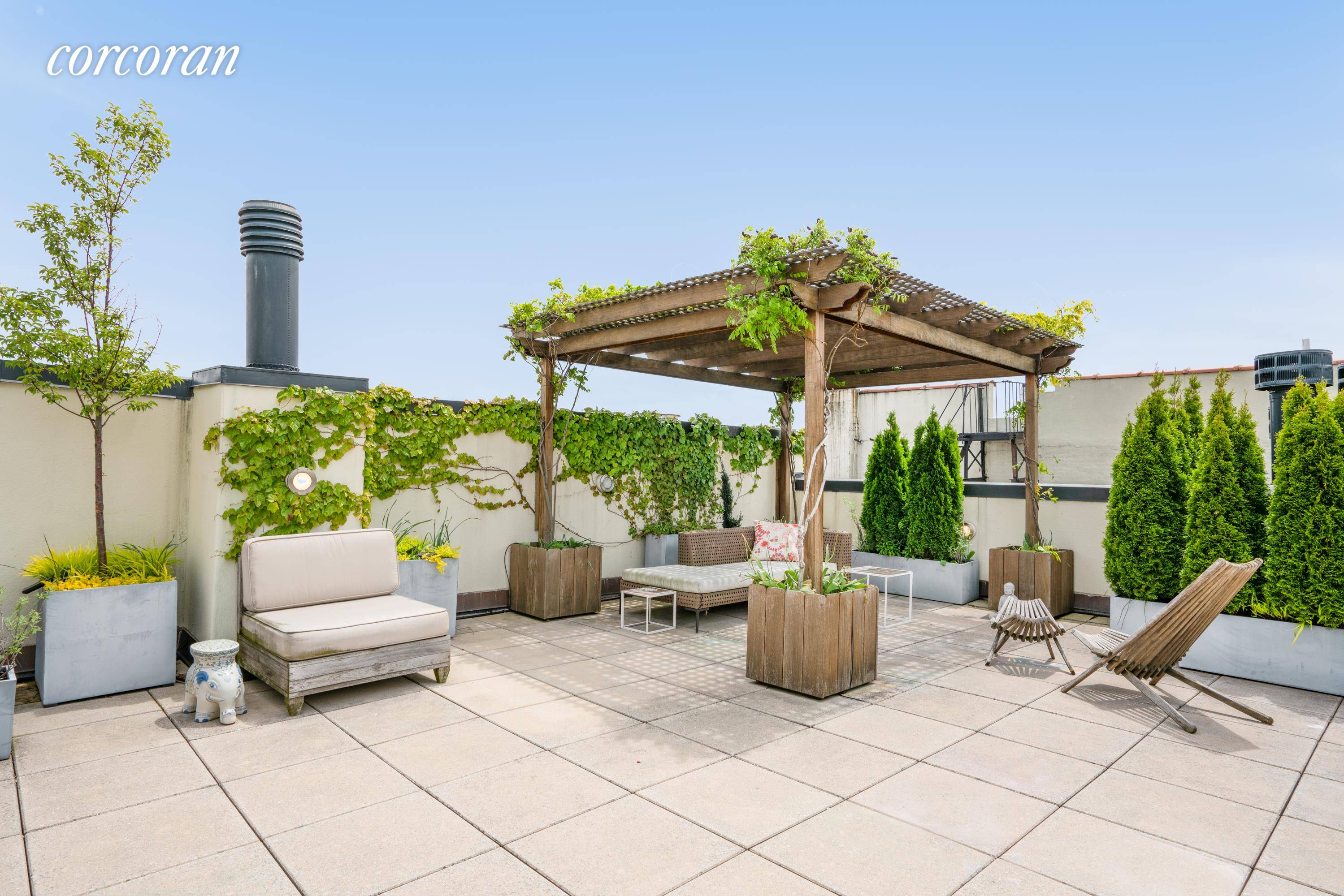 Extraordinarily rare Penthouse atop the Carriage House Loft Condominiums featuring an enormous, professionally landscaped rooftop garden perched above !