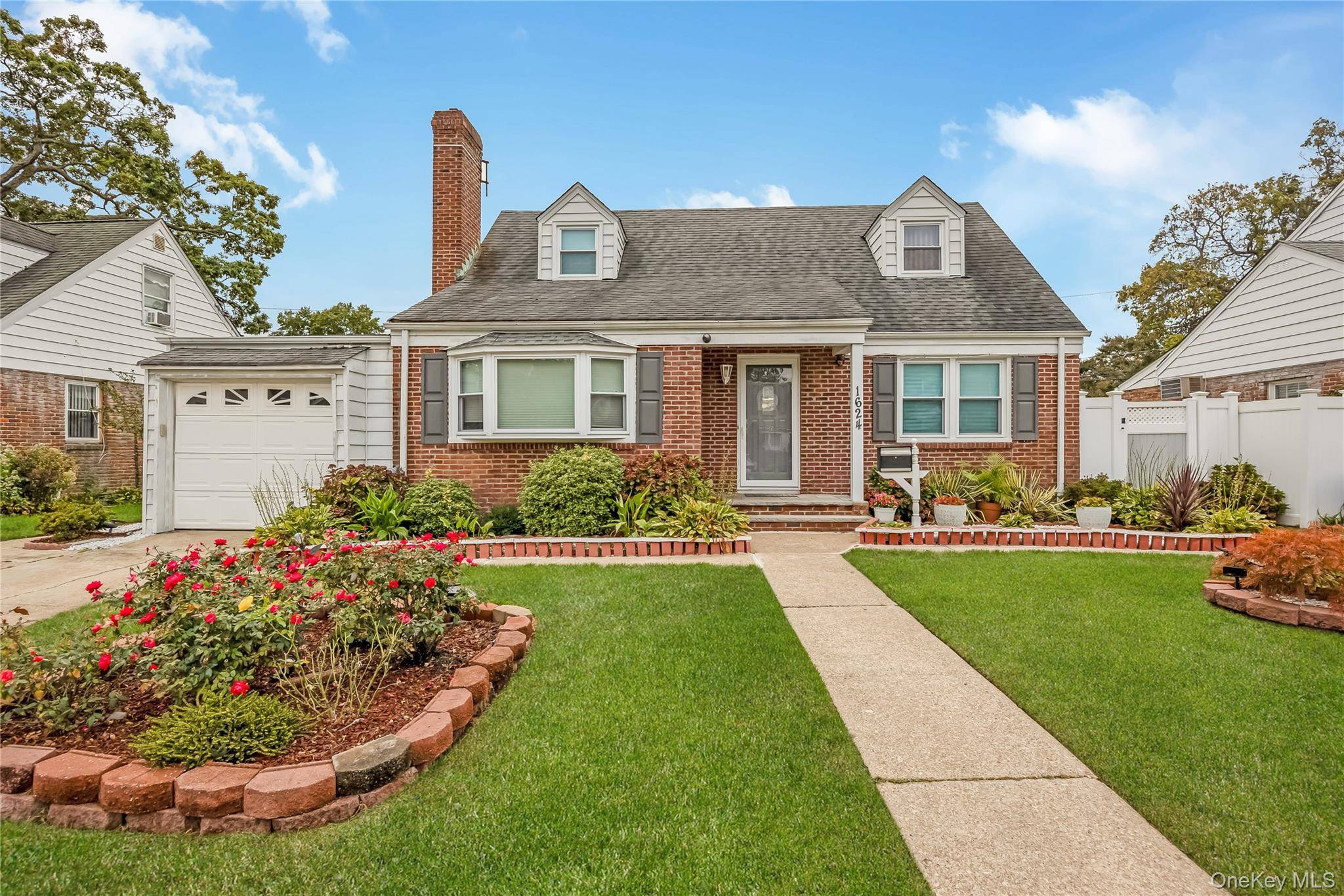 This elegant 4 bedroom, 2 full bath Cape home blends classic charm with space.