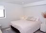 Bedroom with wood finished floors and recessed lighting