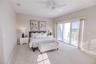 Spacious primary suite with elevated water views and private balcony.