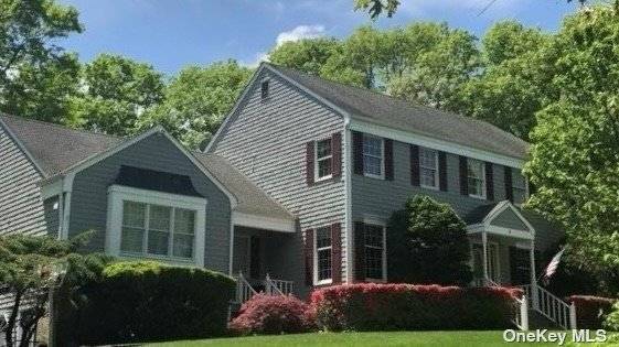 Center Hall Colonial on just shy of an acre hill top setting !