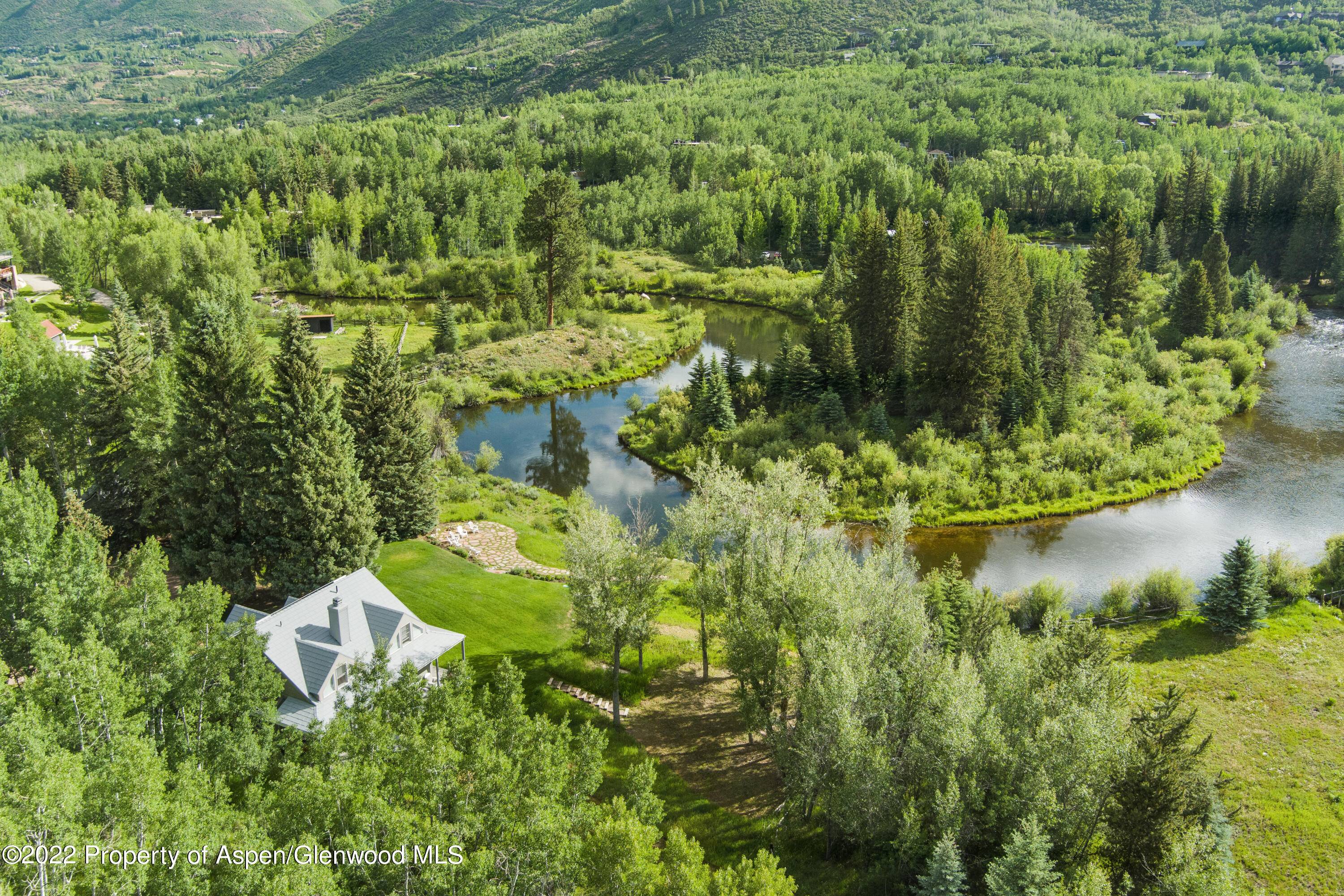 Located at the end of Ute Avenue along a bend in the Roaring Fork River sits a spectacular 2.