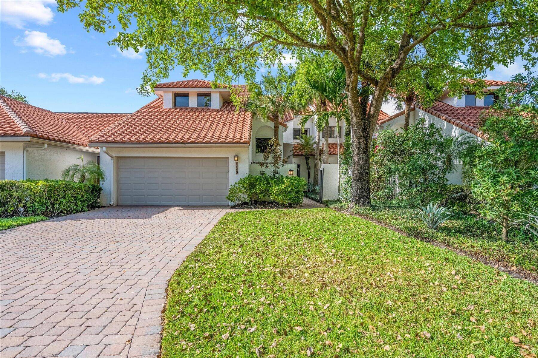 Elegantly appointed two story Town House in the lovely Windsor Way neighborhood in Palm Beach Polo.