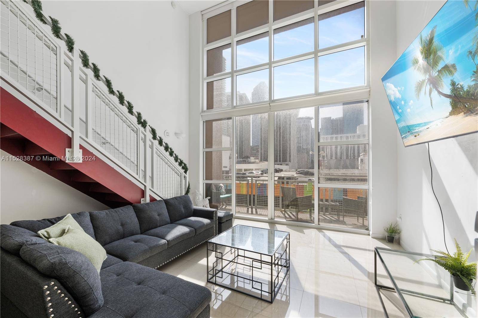 Exceptional two story urban loft with balcony, offering city views.