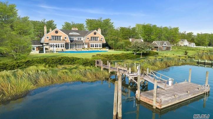 Tranquil waterviews distinguishes this quintessential Hamptons retreat.