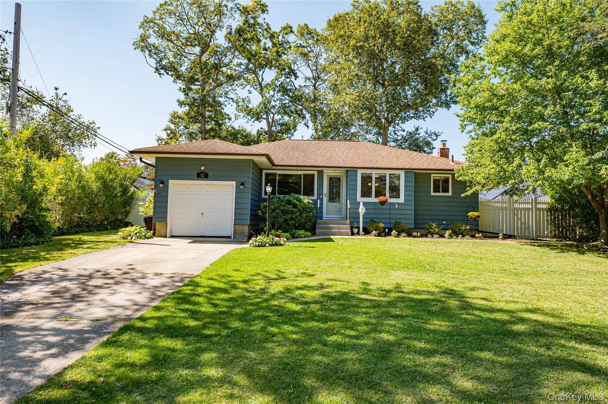 Located on a quiet, tree lined street in a highly desired neighborhood, this mid block 3 bedroom ranch boasts hardwood floors throughout, full basement and open concept living.