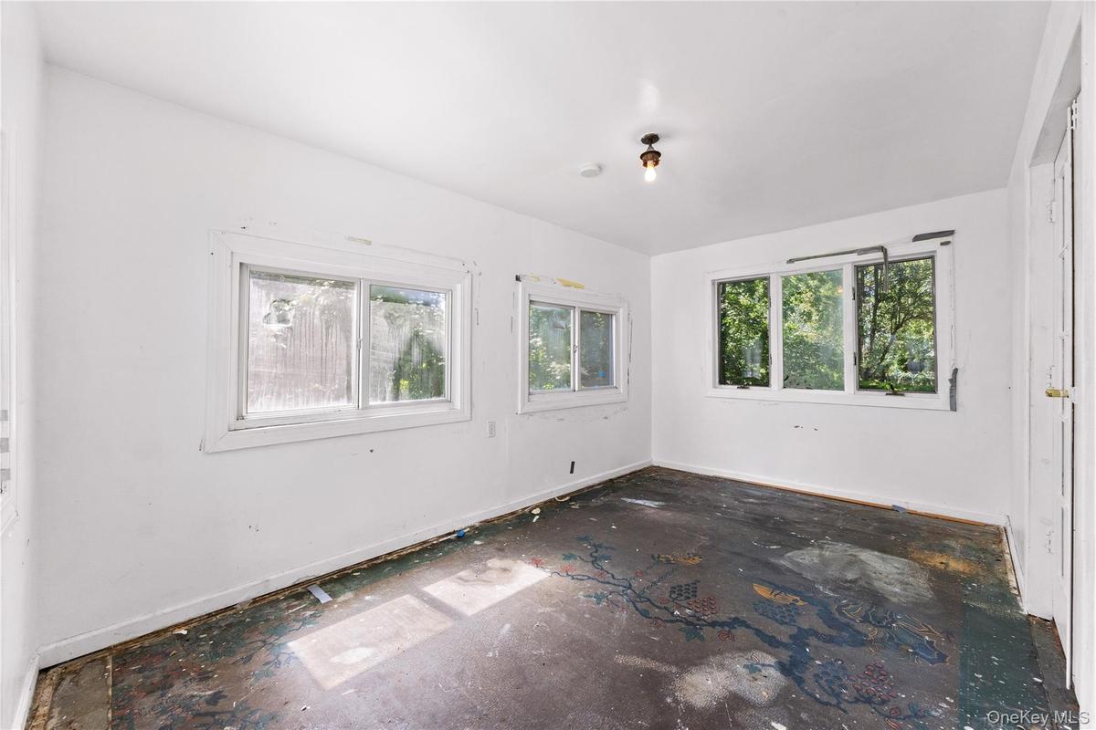 Unheated sunroom off living room.