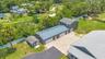 Aerial View of ADU, 6 car garage, Workshop (2 car space) and 2/1 guest unit with a loft and kitchenBrand new Hardie Board siding on ADU, metal roof on