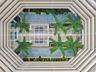 Birds-eye view of the stunning open-air atrium, bringing natural light and tropical beauty to the heart of the building.