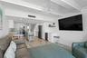 Great Room w/ custom paneling and beamed ceilings. Open Floor Plan.