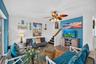Family room with view to upper level stairs.