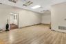 Unfurnished room featuring a paneled ceiling and light wood-style flooring