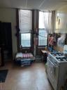 Kitchen featuring range and a paneled ceiling
