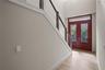 Grand foyer makes an immediate impression wit its soaring two-story ceilings and abundant natural light. Impressive double front doors with decoratio