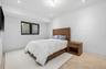 Bedroom with recessed lighting and baseboards