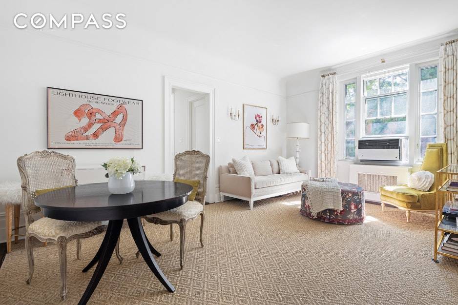 Sunlight beams through the large windows of this gracious one bedroom home with Southern exposure over West 12th Street.