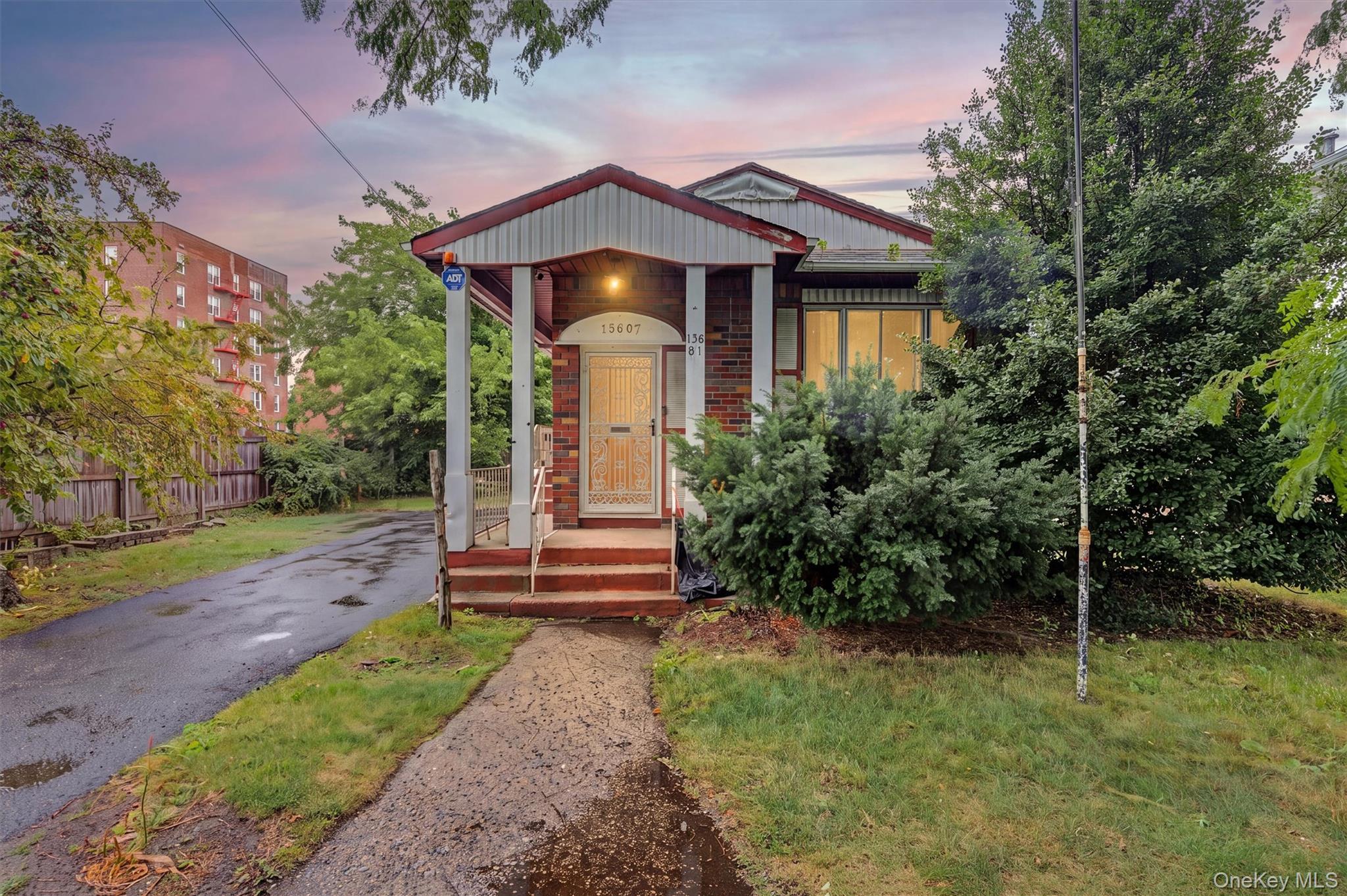 Brick exterior with a covered porch