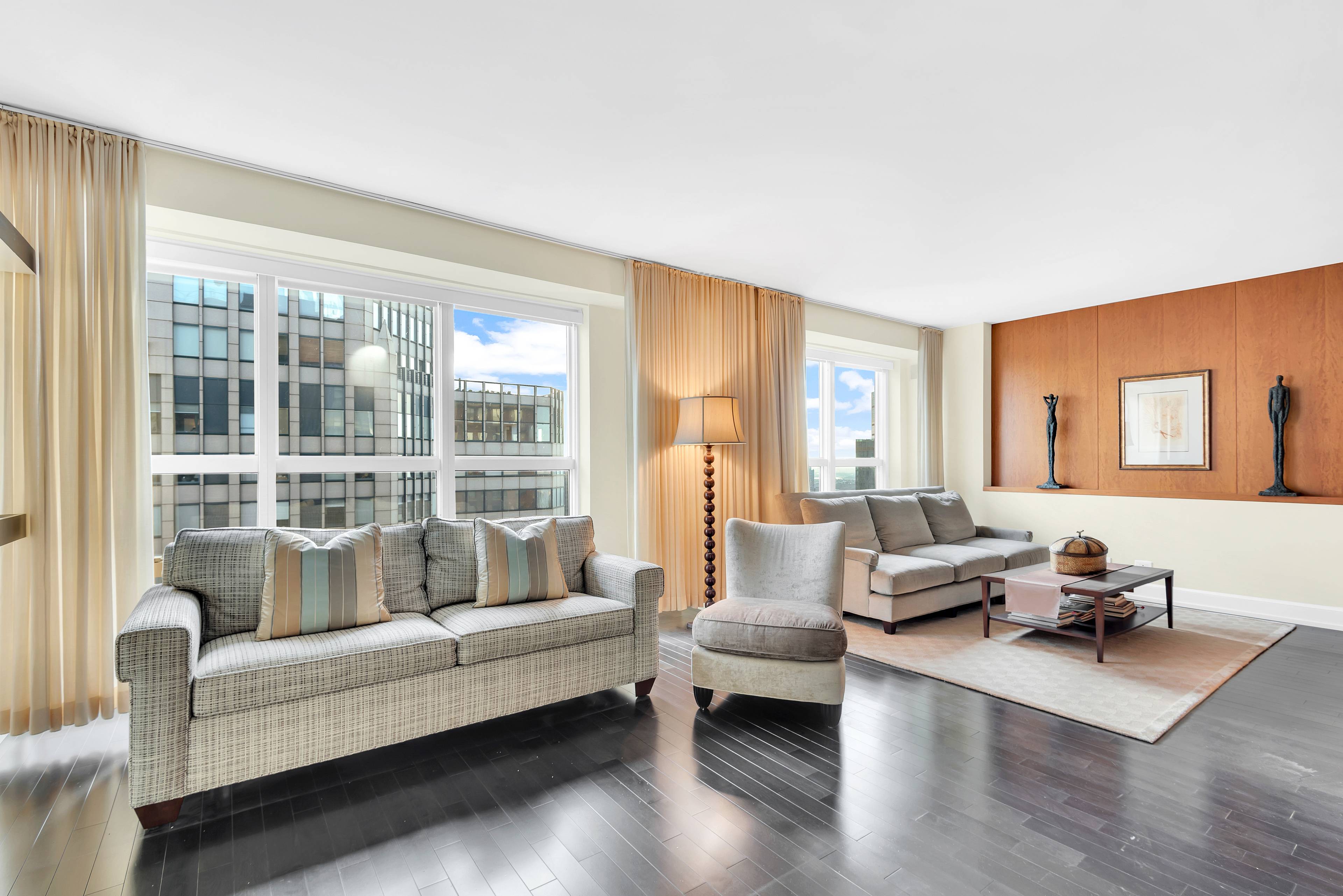 Sunny Southern skyline views from this impeccably designed duplex at the Metropolitan Tower condominium.