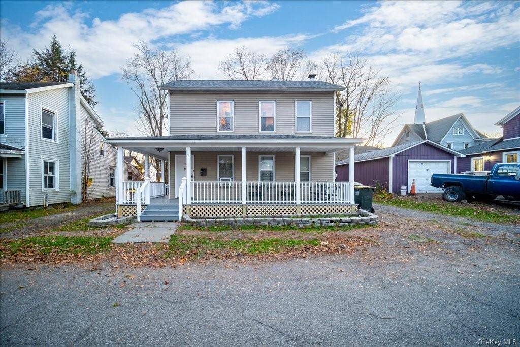 This charming multi family home offers a peaceful retreat on a quiet block.