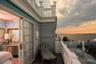 Balcony at dusk with a water view
