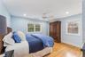 Bedroom featuring light wood-style floors, a ceiling fan, and recessed lighting