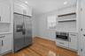 Kitchen featuring backsplash, white cabinetry, and recessed lighting