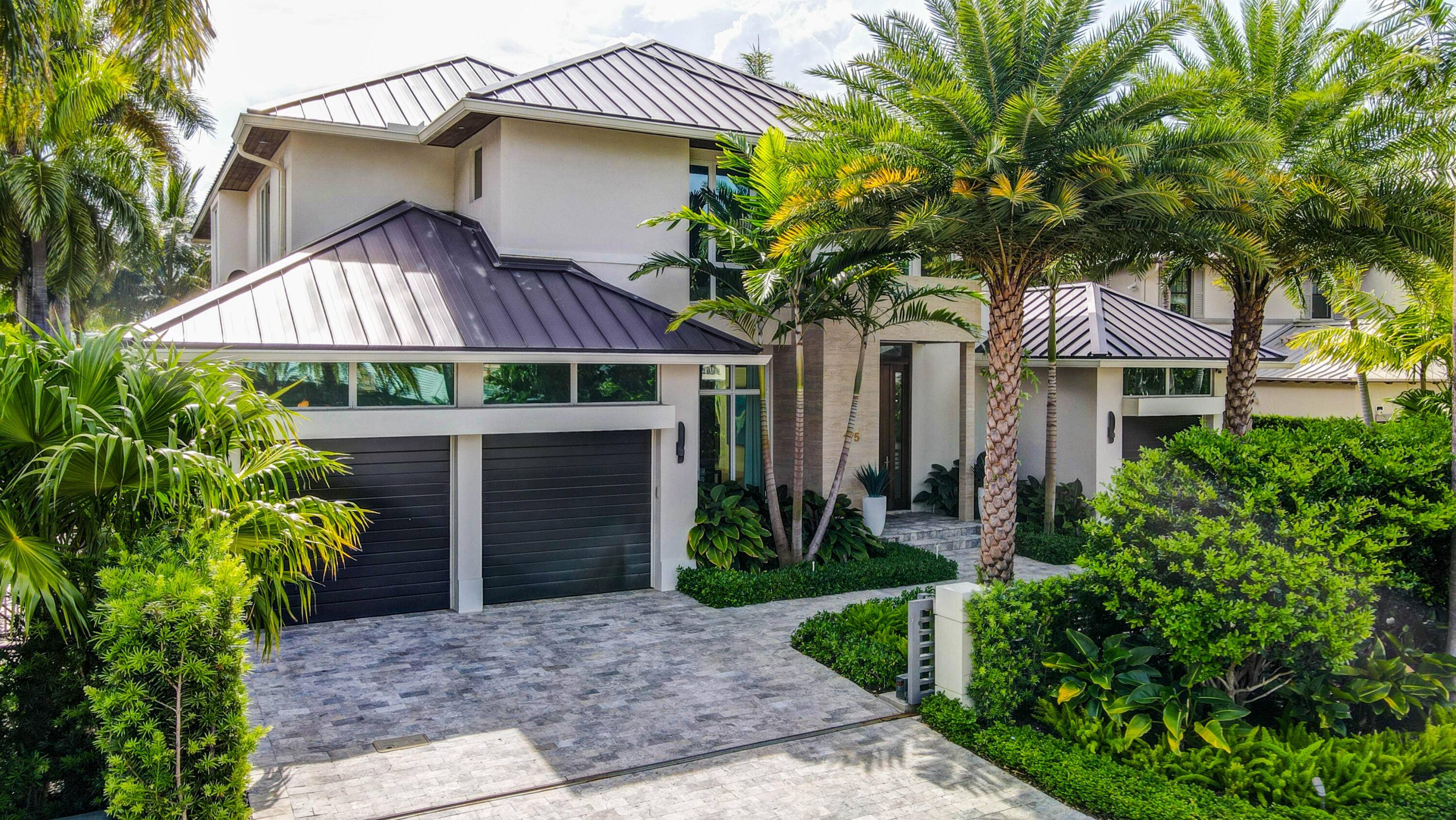 Modern deepwater Las Olas Isles home with striking architecture, sophisticated floor plan and finishes, and water views from all main living areas.