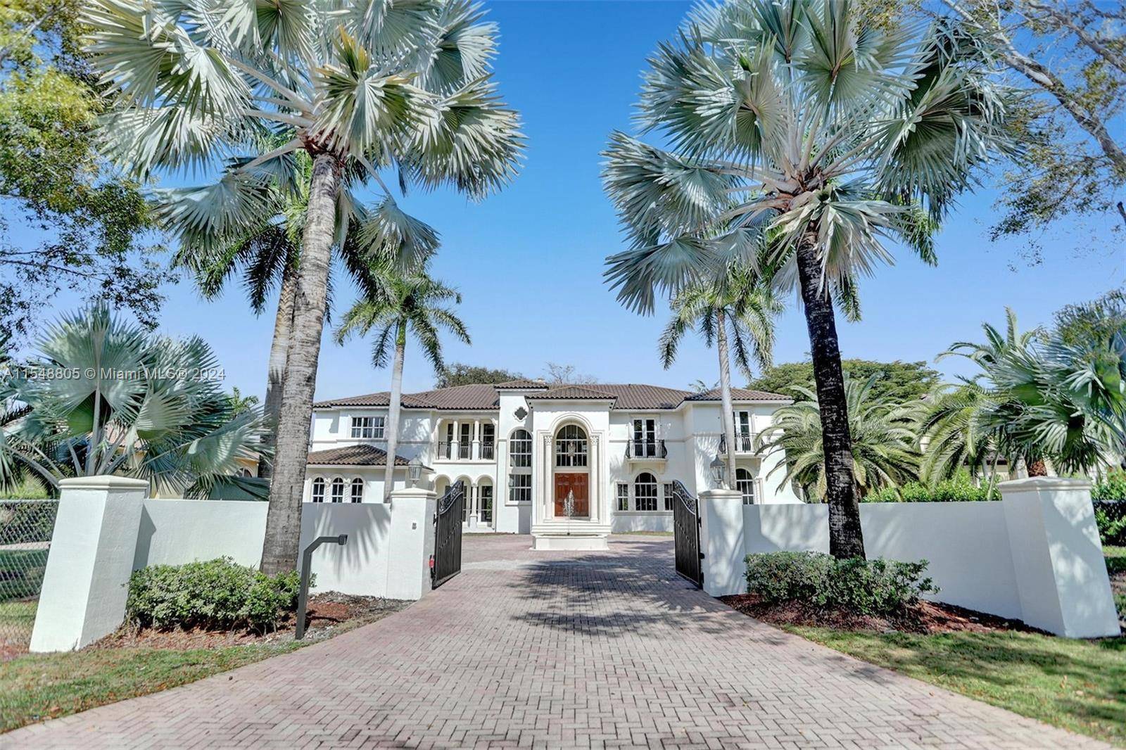 Two story Mediterranean Estate in sought after North Pinecrest located on a quiet street.