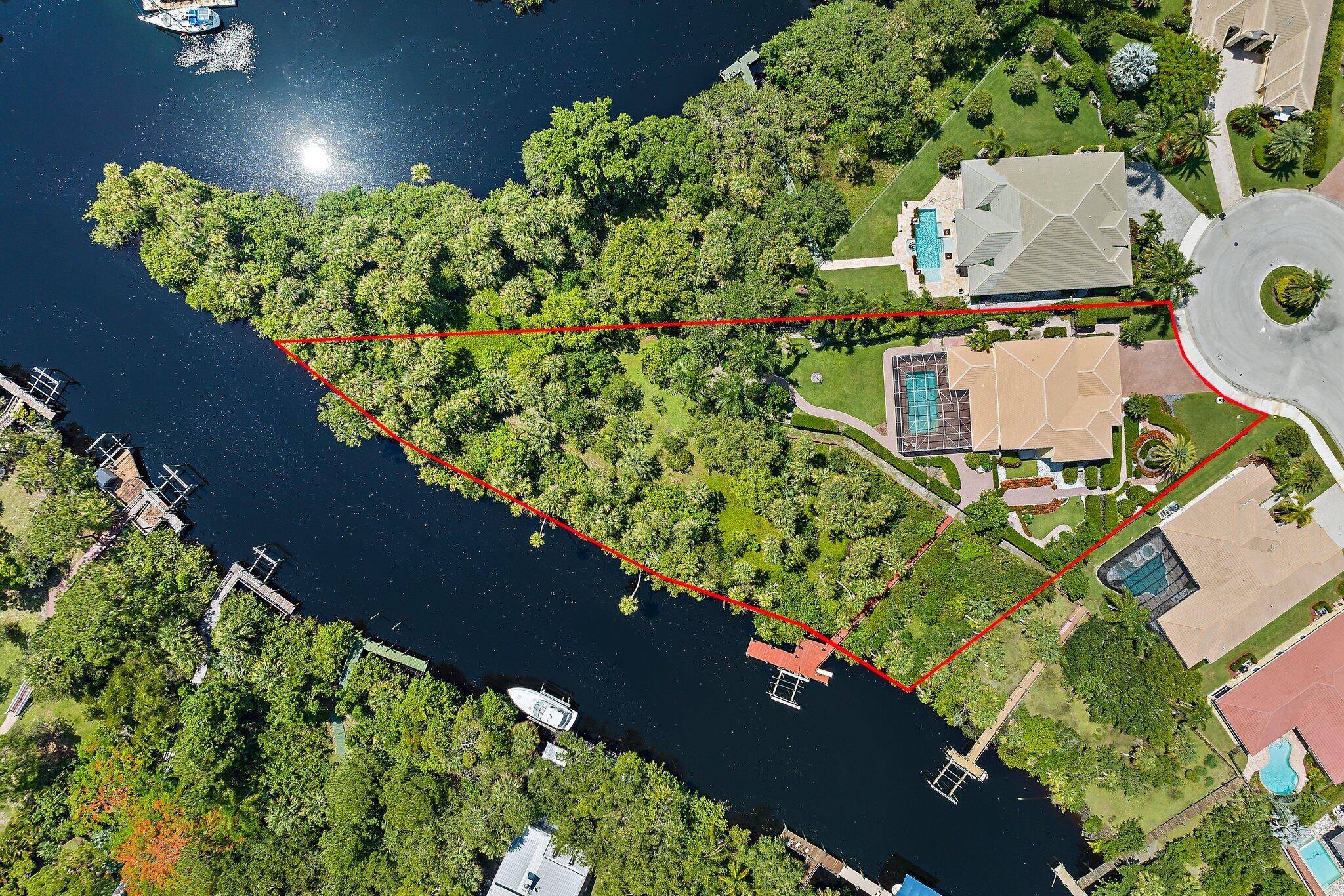 This amazing property, located on an acre parcel with a private dock, 20, 000 Lbs.