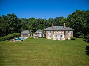 THIS STATELY, CUSTOM BRICK LIMESTONE GEORGIAN IS BEAUTIFULLY SITED ON 4 MAGNIFICENT AND PRIVATE ACRES LOCATED ON A PRIVATE LANE IN ROUND HILL.