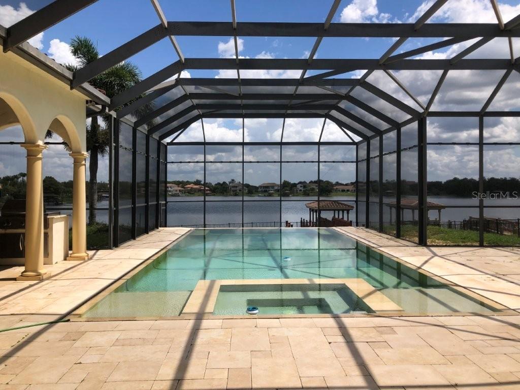 In-ground pool with screen enclosure