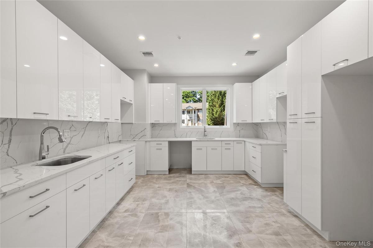 Designer kitchen with ample cabinetry