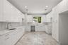 Designer kitchen with ample cabinetry