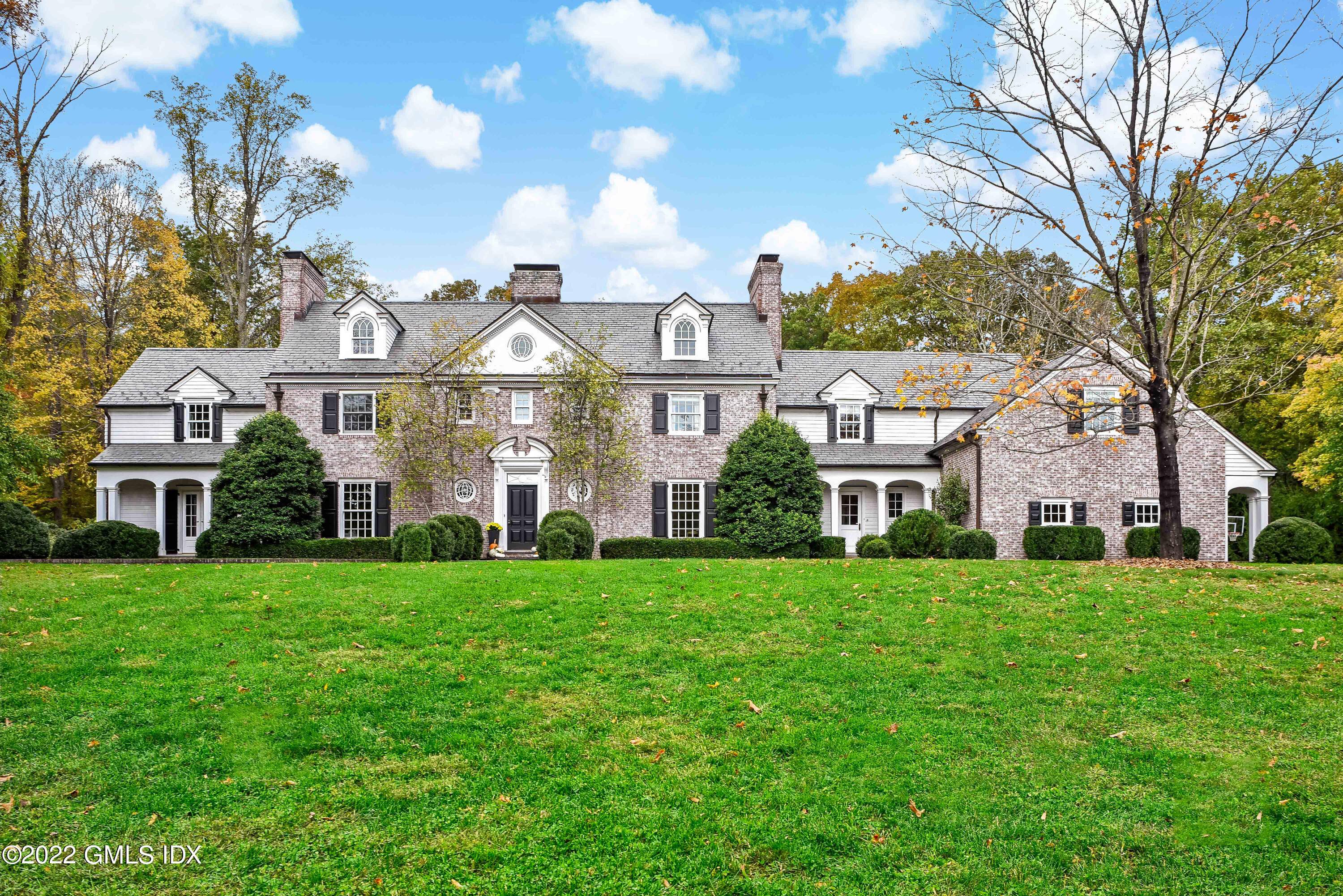 Located on one of New Canaan's most desirable West side streets is this beautiful brick Georgian colonial blends today's modern amenities with the charm and character of yesteryear.