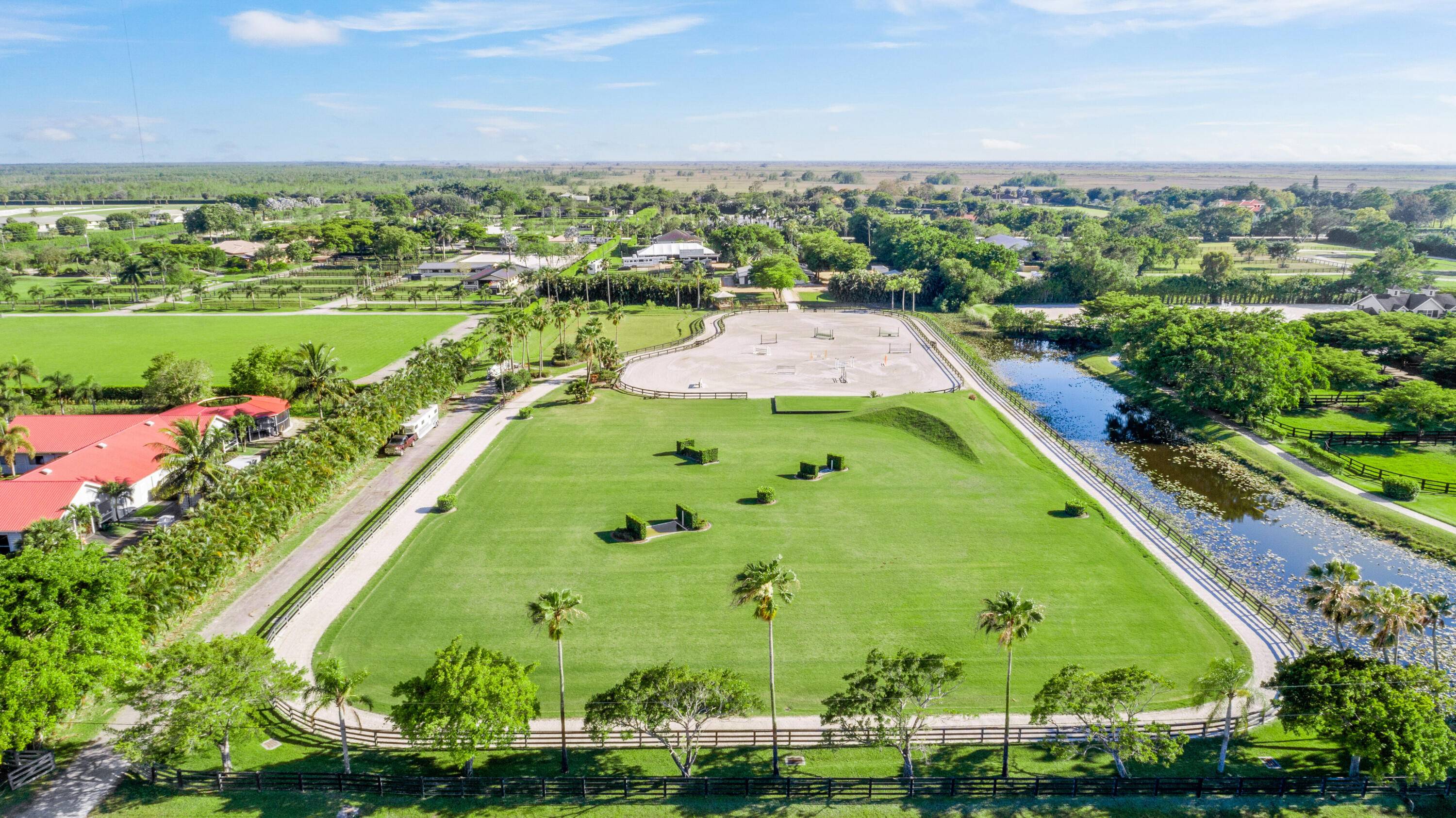 Equestrians dream farm on 10 AC 2 five acre lots with large all weather arena and spacious Grand Prix field with bank and water jump.