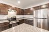 Wood cabinets and stainless steel appliances