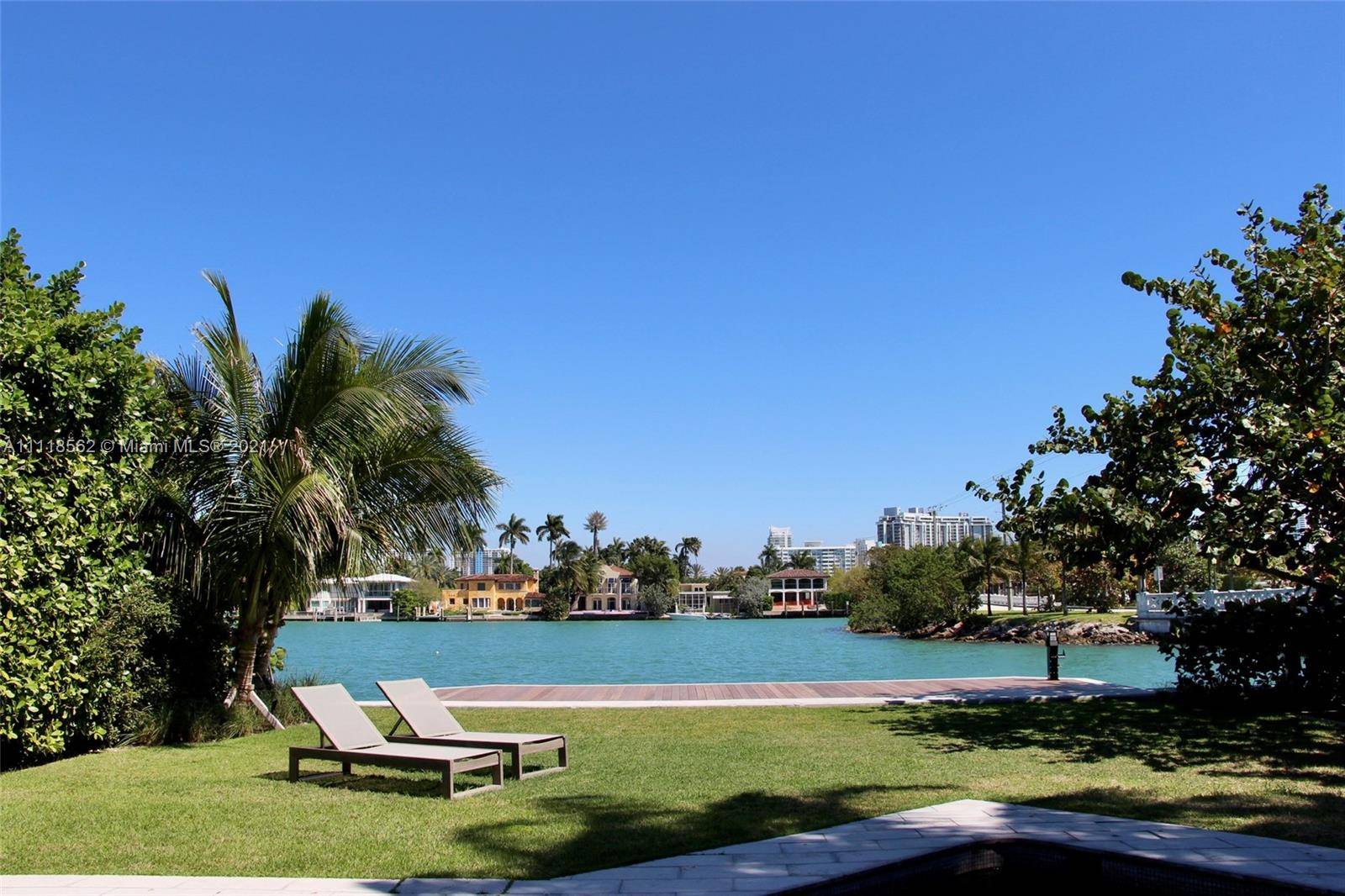 Enjoy the delights of waterfront living on the Venetian Islands in this Tropical Modern Gem !