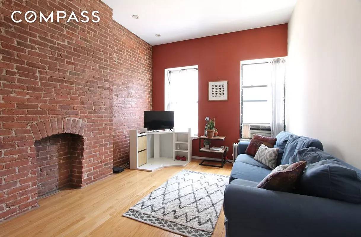 E 80s Large 3BD 2BA with Sprawling Hardwood Floors, Exposed Brick, Fireplace, Separate Kitchen with M W, D W, and Breakfast Bar, In Unit Washer and Dryer, Recessed Lighting, and ...