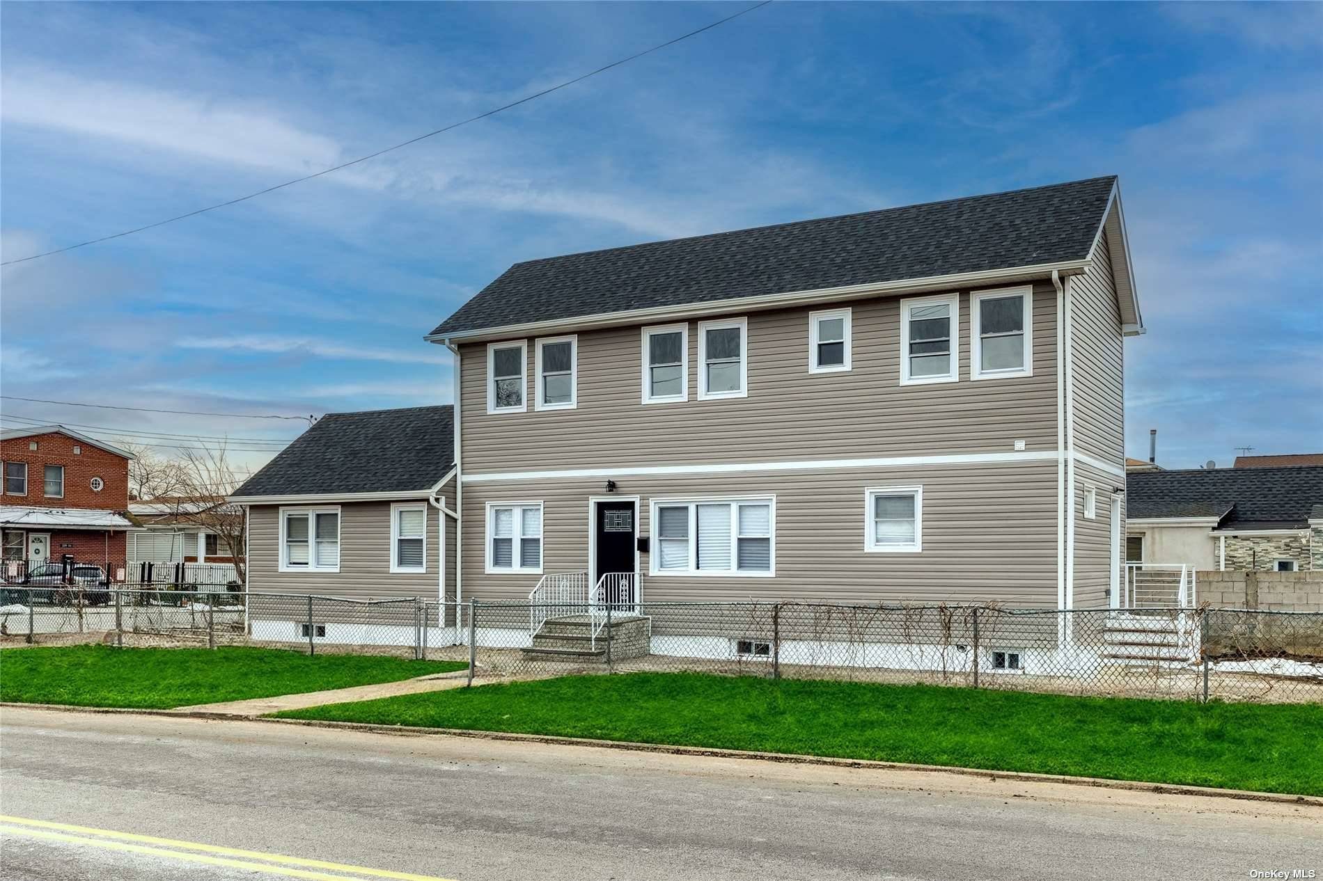 Huge fully renovated 1 family 4 bedrooms 3 full bath 2 kitchens marble countertop stainless stainless steel appliances finished 1 bedroom basement rental unit with separate entrance.