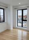 Empty room featuring light wood-style flooring and recessed lighting