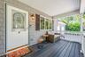 Doorway to property with covered porch