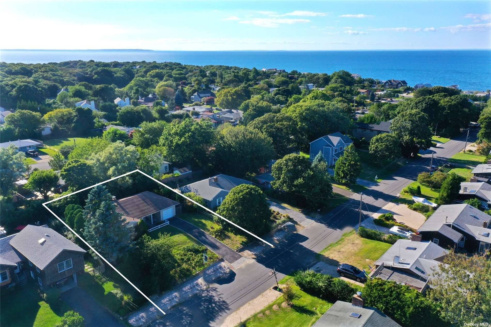 Montauk beach house consisting of three bedrooms, two full baths, living room with fireplace, kitchen, dining area and laundry room.
