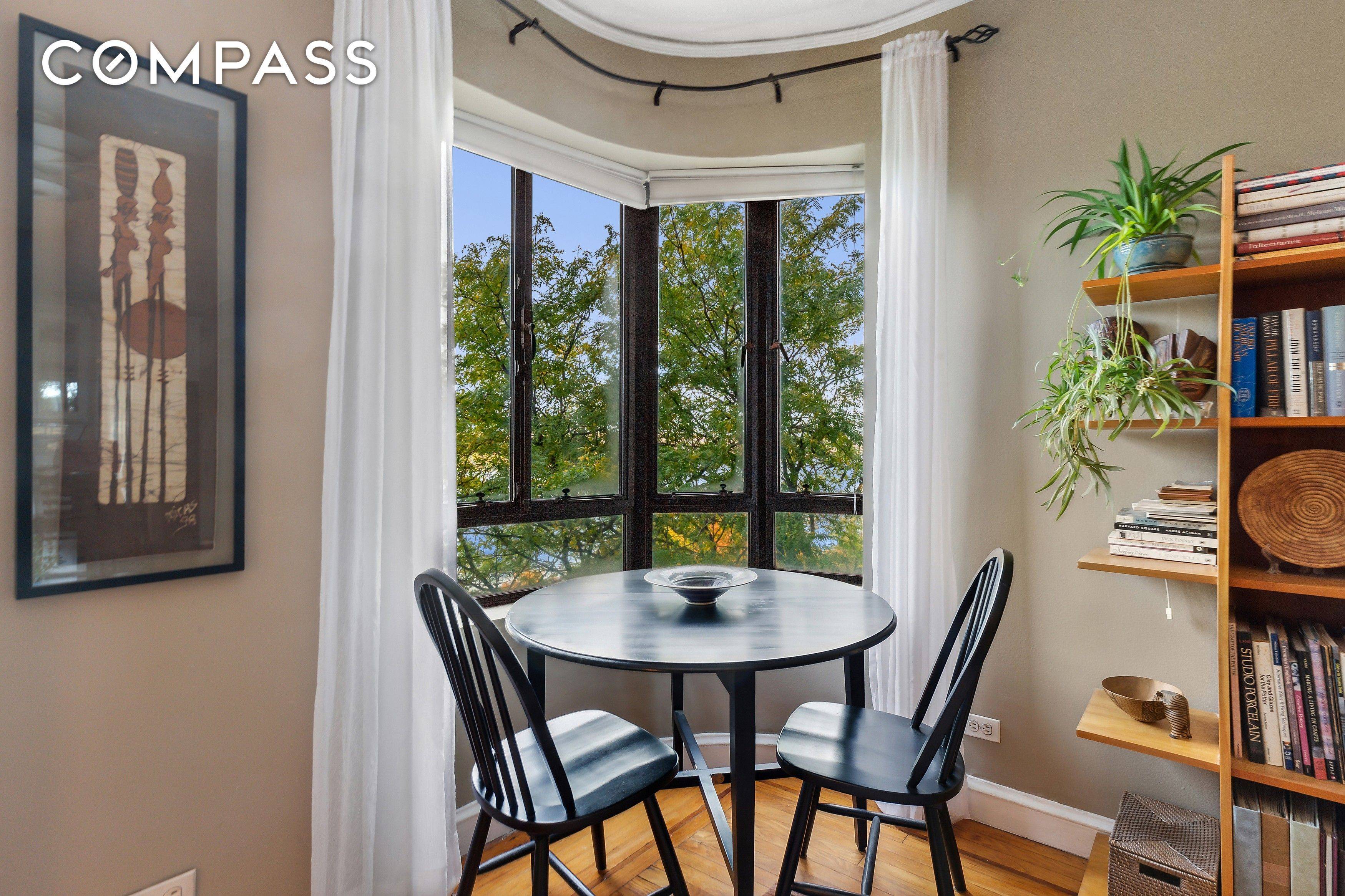 COVETED CHITTENDEN AVENUE ONE BEDROOM Every window in this stunner looks onto natural beauty.